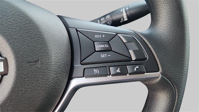 Photo of 2025 Aspen White Tricoat Nissan Versa