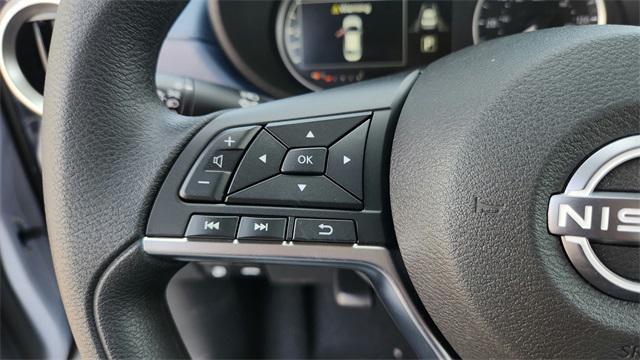 Photo of 2025 Aspen White Tricoat Nissan Versa