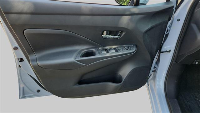 Photo of 2025 Aspen White Tricoat Nissan Versa