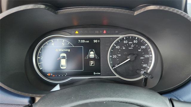 Photo of 2025 Aspen White Tricoat Nissan Versa