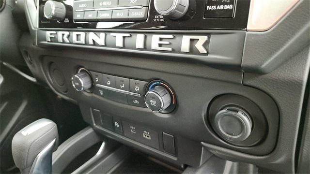 Photo of 2025 Glacier White Nissan Frontier