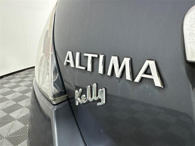 Photo of 2010 Dark Slate Metallic Nissan Altima