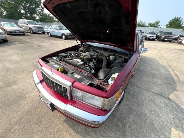 Photo of 1990 Burgundy Lincoln Town Car