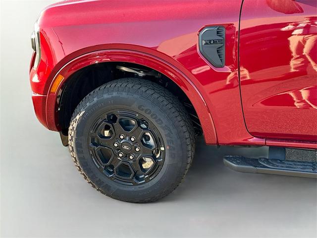Photo of 2025 Ruby Red Metallic Tinted Clearcoat Ford Ranger