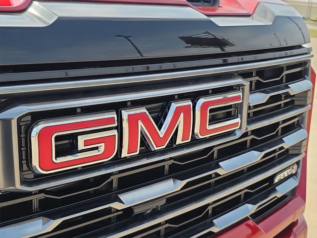 Photo of 2025 Volcanic Red Tintcoat GMC Sierra 2500