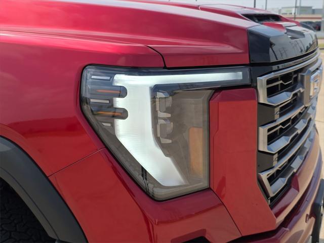 Photo of 2025 Volcanic Red Tintcoat GMC Sierra 2500