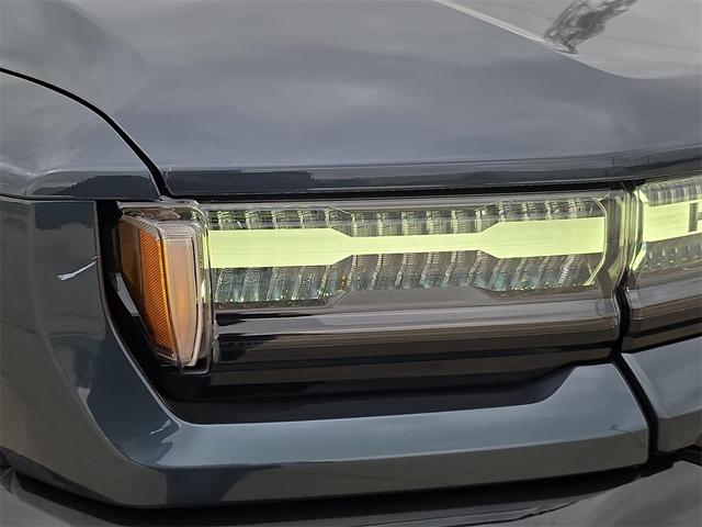 Photo of 2025 Graphite Blue Metallic GMC HUMMER EV Pickup
