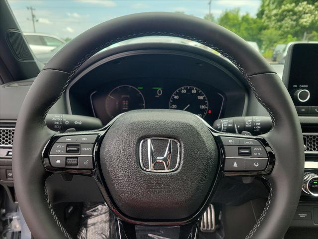 Photo of 2025 Sonic Gray Pearl Honda Civic Hybrid