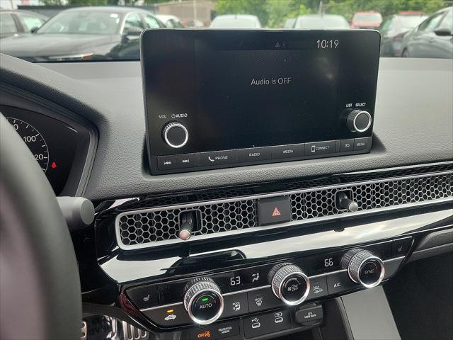 Photo of 2025 Sonic Gray Pearl Honda Civic Hybrid