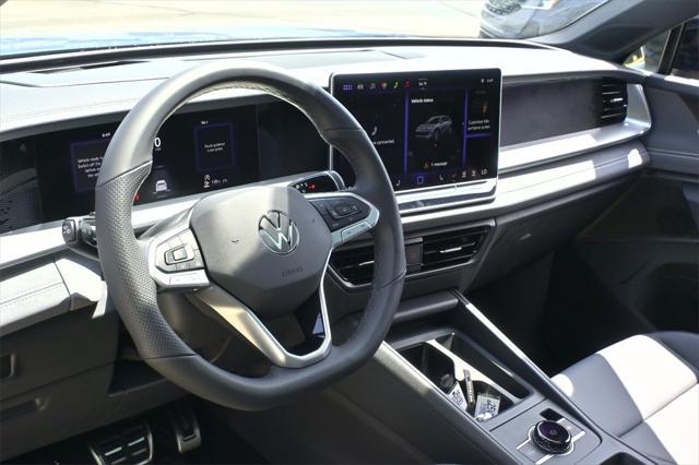 Photo of 2025 Monterey Blue w/Deep Black Roof Volkswagen Tiguan