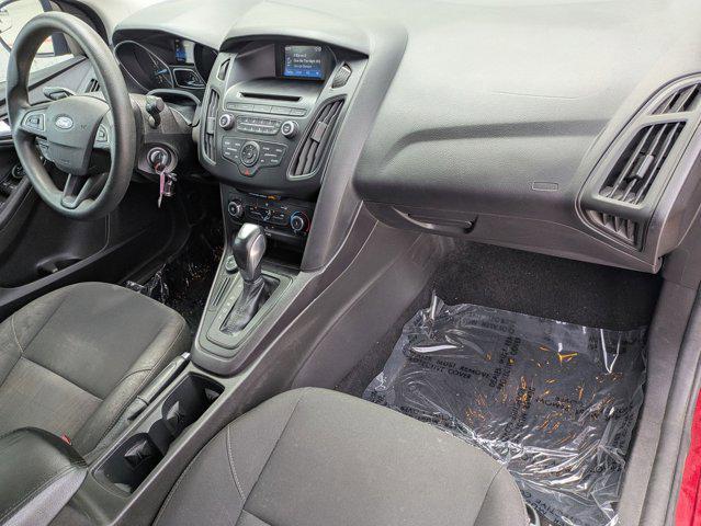Photo of 2015 Ruby Red Metallic Tinted Clearcoat Ford Focus