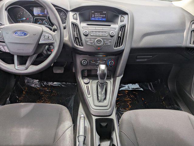 Photo of 2015 Ruby Red Metallic Tinted Clearcoat Ford Focus