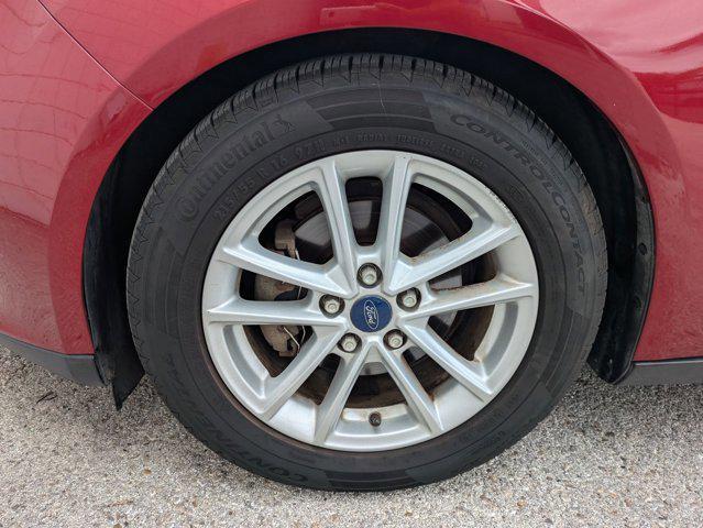 Photo of 2015 Ruby Red Metallic Tinted Clearcoat Ford Focus