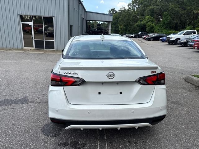 Photo of 2024 Aspen White Tricoat Nissan Versa
