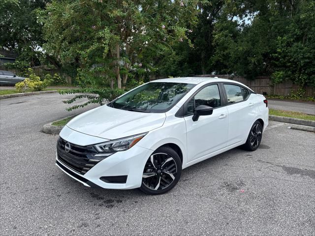Photo of 2024 Aspen White Tricoat Nissan Versa