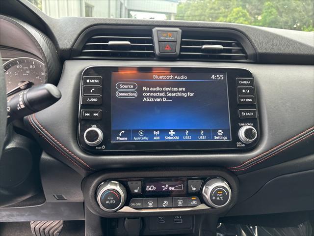 Photo of 2024 Aspen White Tricoat Nissan Versa