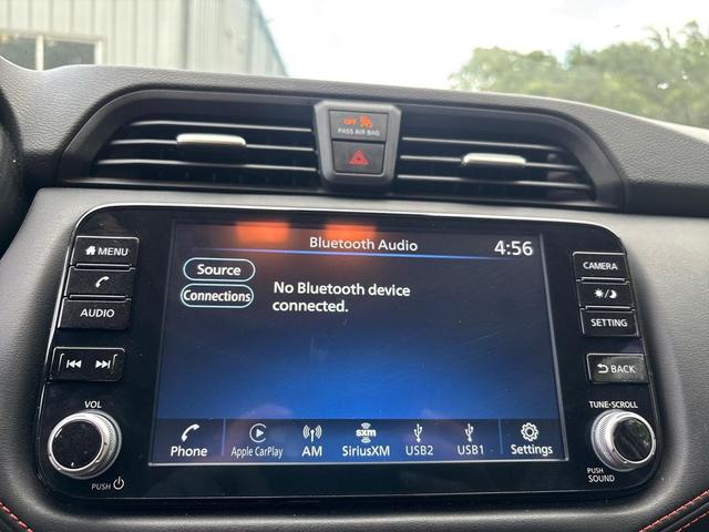 Photo of 2024 Aspen White Tricoat Nissan Versa