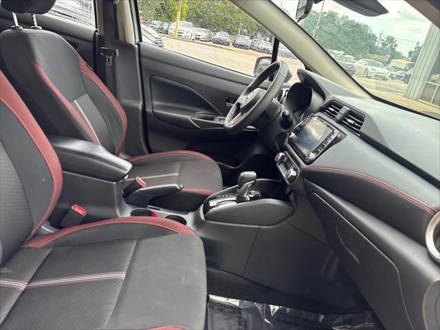 Photo of 2024 Aspen White Tricoat Nissan Versa