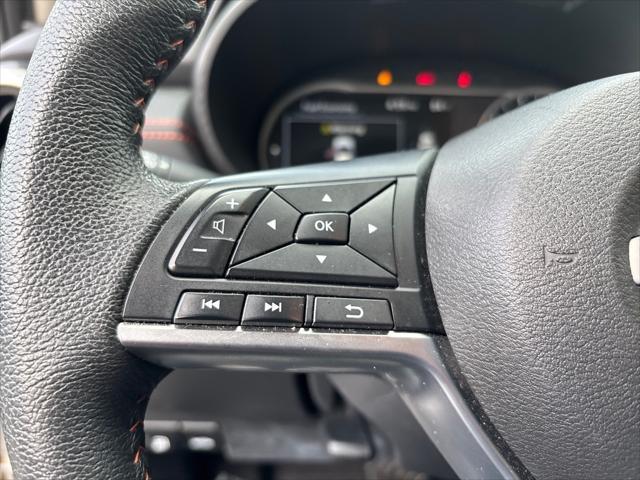 Photo of 2024 Aspen White Tricoat Nissan Versa