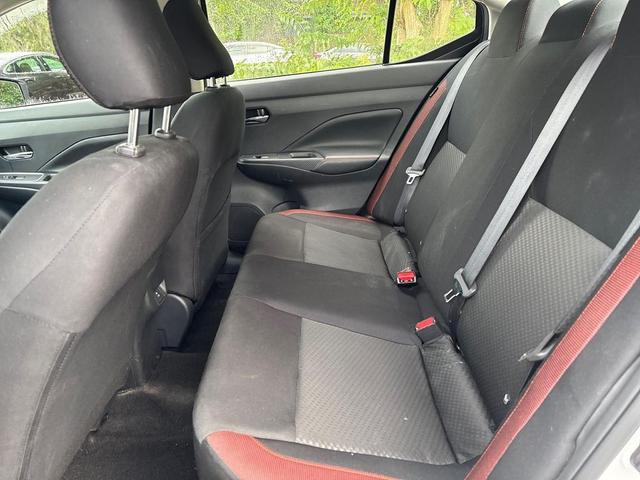 Photo of 2024 Aspen White Tricoat Nissan Versa