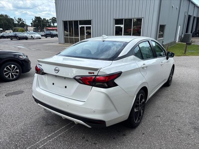 Photo of 2024 Aspen White Tricoat Nissan Versa