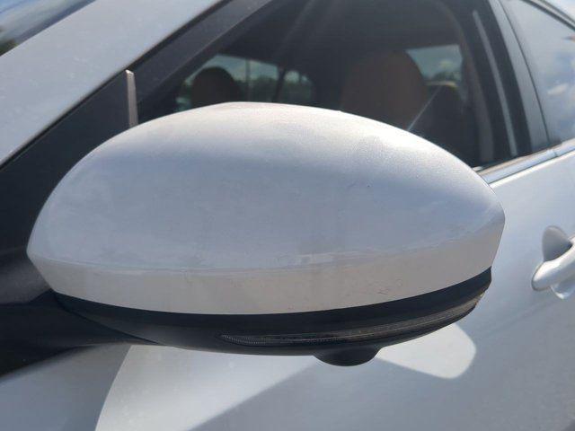 Photo of 2025 Aspen White Tricoat Nissan Sentra