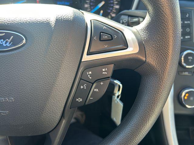 Photo of 2015 Ruby Red Tinted Clearcoat Ford Fusion