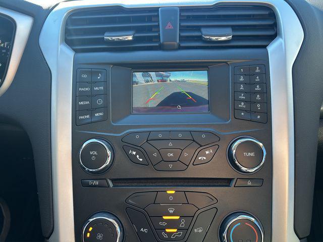 Photo of 2015 Ruby Red Tinted Clearcoat Ford Fusion