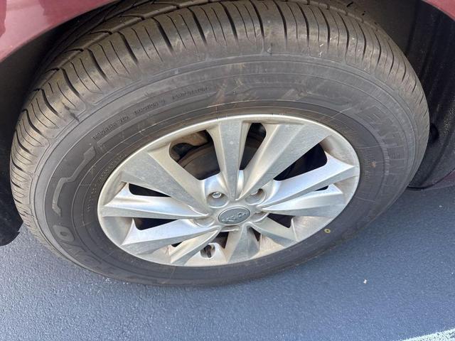 Photo of 2015 Black Berry Kia Sedona