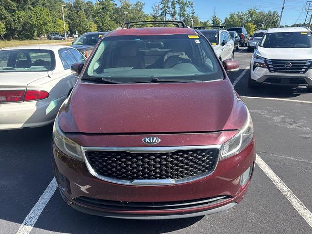 Photo of 2015 Black Berry Kia Sedona