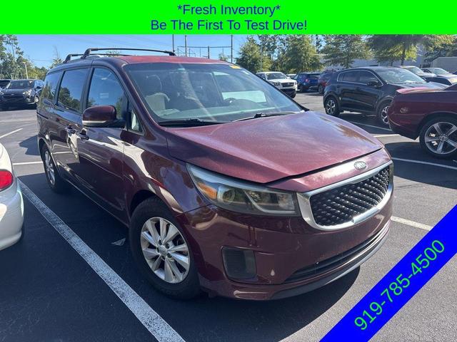 Photo of 2015 Black Berry Kia Sedona