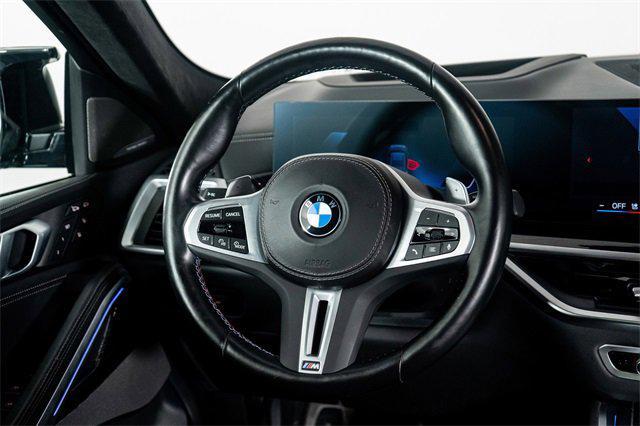 Photo of 2024 Black Sapphire Metallic BMW X6