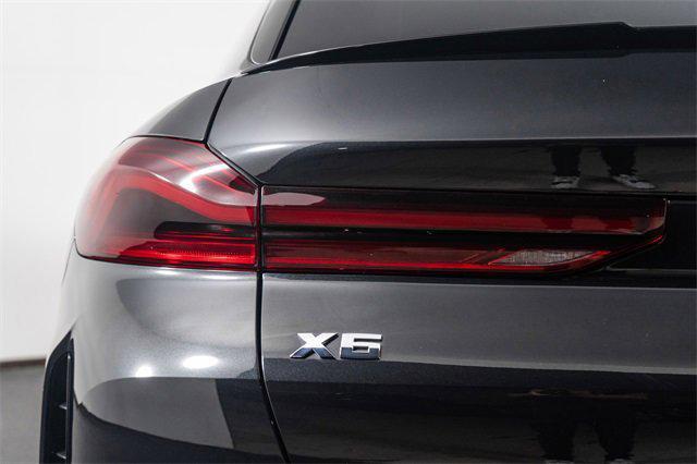Photo of 2024 Black Sapphire Metallic BMW X6