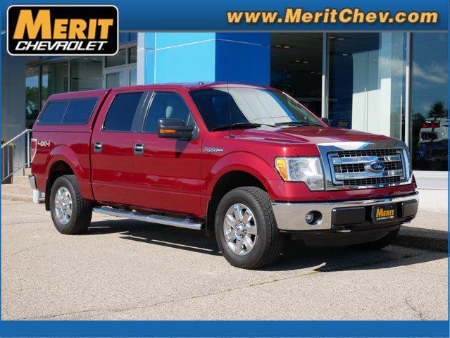 Photo of 2014 Ruby Red Metallic Tinted Clearcoat Ford F-150