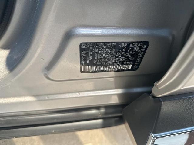 Photo of 2023 Champagne Silver Metallic Nissan Rogue