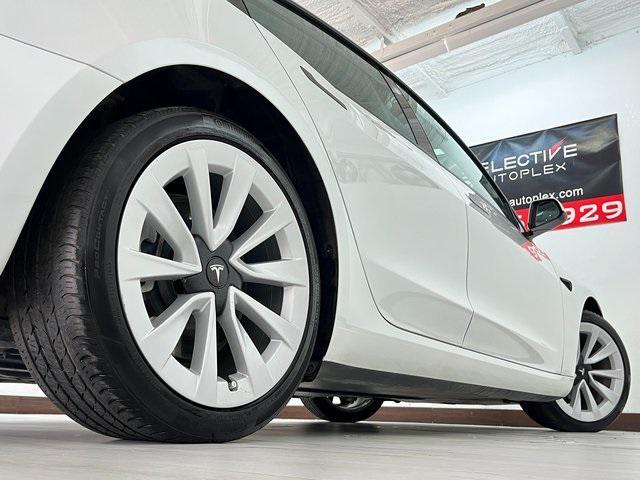 Photo of 2023 Pearl White Tesla Model 3