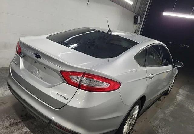 Photo of 2016 Ingot Silver Ford Fusion Hybrid