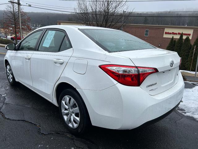 Photo of 2015 white Toyota Corolla