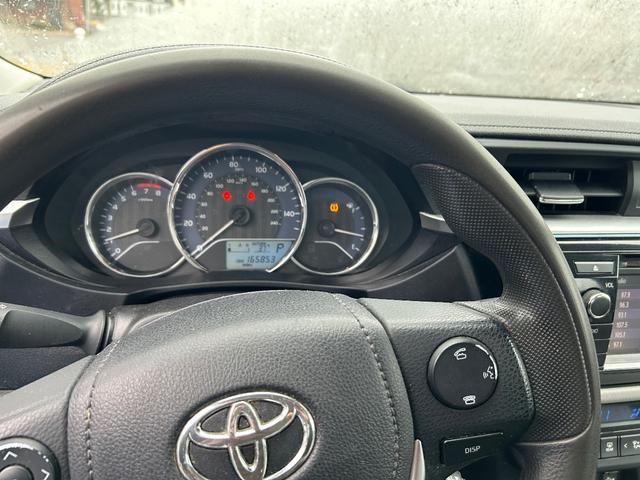 Photo of 2015 white Toyota Corolla