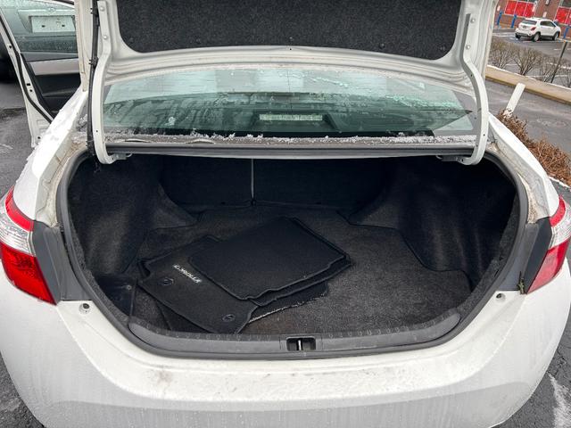 Photo of 2015 white Toyota Corolla