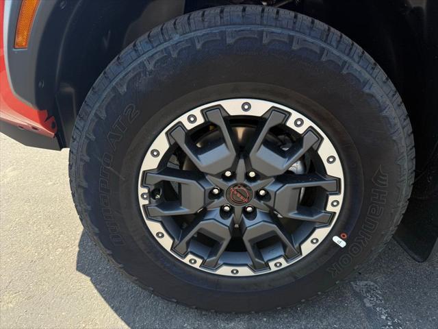 Photo of 2025 Afterburn Orange Nissan Frontier