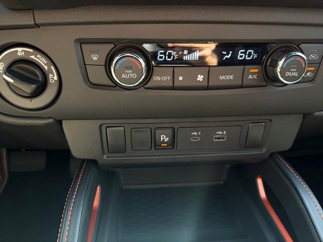 Photo of 2025 Afterburn Orange Nissan Frontier