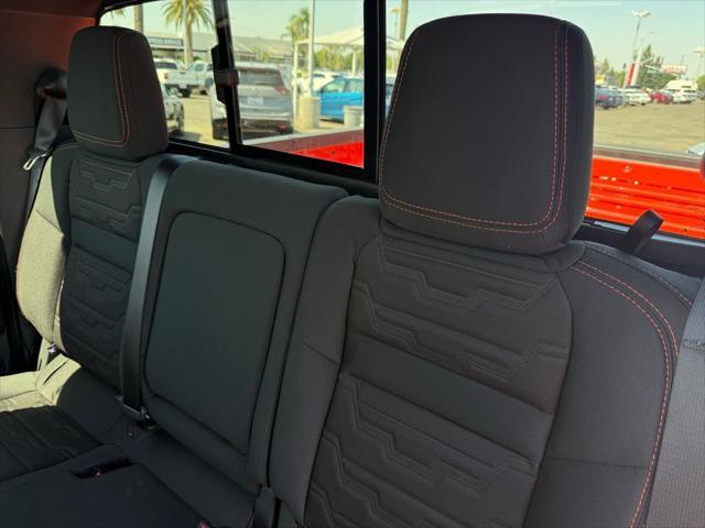 Photo of 2025 Afterburn Orange Nissan Frontier