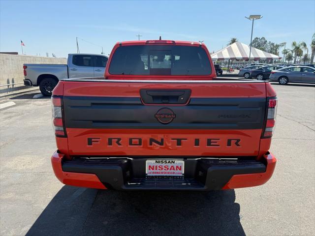 Photo of 2025 Afterburn Orange Nissan Frontier