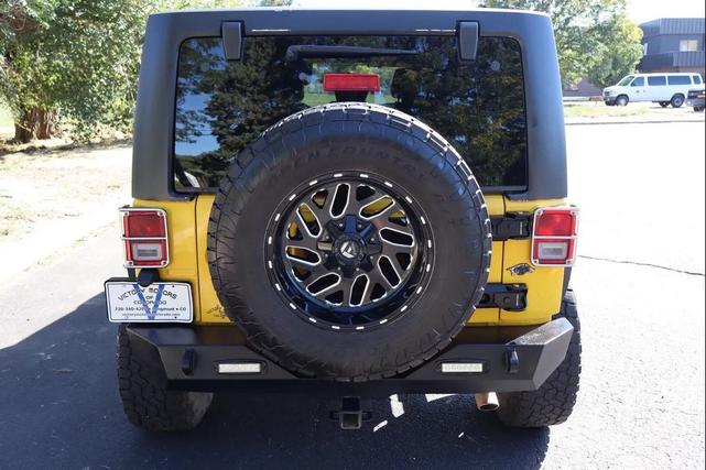 Photo of 2011 Yellow Jeep Wrangler Unlimited