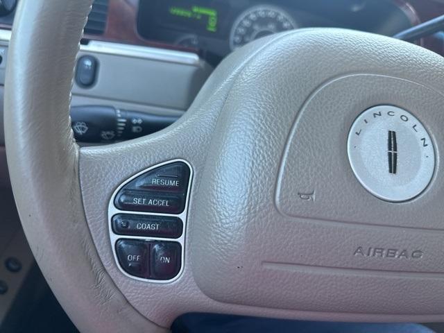 Photo of 2004 Tan Lincoln Town Car