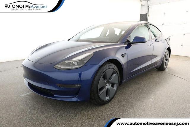 Photo of 2022 Deep Blue Metallic Tesla Model 3