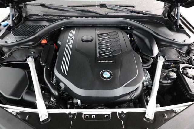 Photo of 2024 Carbon Black Metallic BMW 840