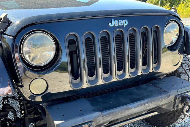 Photo of 2014 Black Clearcoat Jeep Wrangler Unlimited