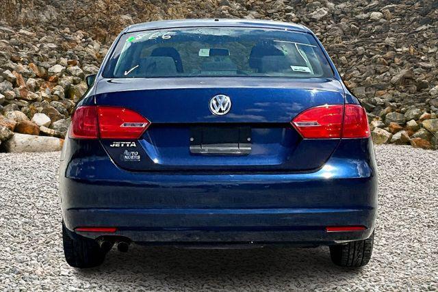 Photo of 2011 Tempest Blue Metallic Volkswagen Jetta